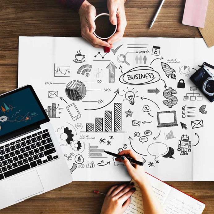 business plan on table and people hands with coffee